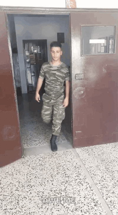 Man In Military Uniform Walking Out Door Saying Awesome GIF