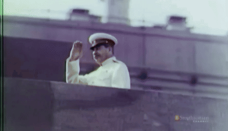 Man In Military Uniform Waving From Balcony Simplychan Channel GIF
