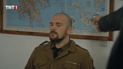 Man In Military Uniform With Map Saying TRT1 GIF