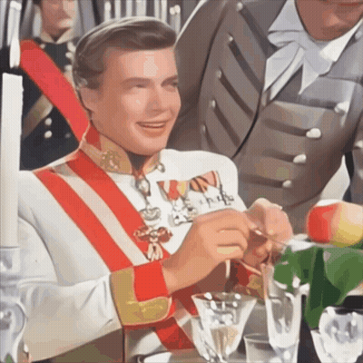 Man In Military Uniform With Red And White Sash Holding Spoon GIF