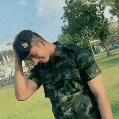 Man In Military Uniform With TNS Badge On Hat GIF