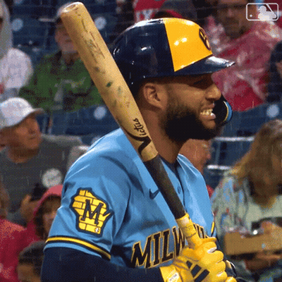 Man In Milwaukee Jersey Holding Bat GIF