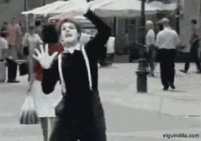Man In Mime Costume Dancing On Street GIF