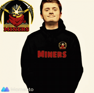 Man In Miners T-Shirt In Front Of Sacramento Miners Logo GIF