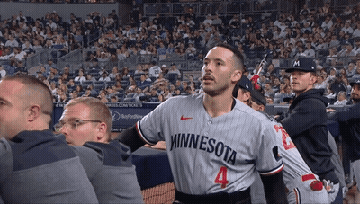 Man In Minnesota Jersey In Crowd GIF