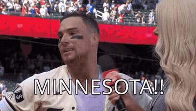Man In Minnesota Jersey Interviewed By Woman In Crowd GIF