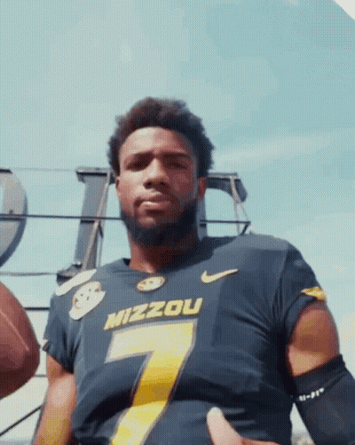 Man In Mizzou Jersey Holding Football GIF