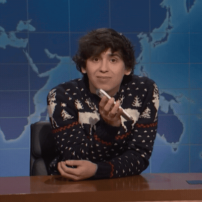 Man In Moose Sweater Holding Pen GIF
