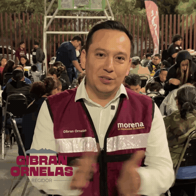 Man In Morena Vest With Crowd GIF