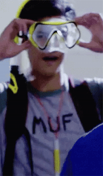 Man In Muf Shirt Putting On Goggles GIF