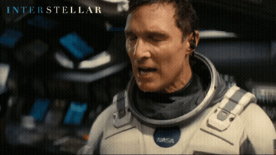 Man In NASA Space Suit Looking GIF