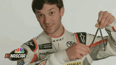 Man In Nascar Jacket Holding Scissors GIF