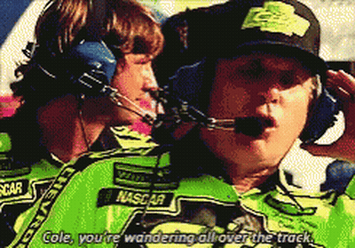 Man In NASCAR Shirt Talking To Man In Headphones GIF