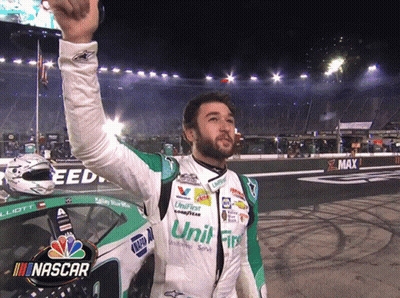 Man In NASCAR Uniform Holding Up Hand GIF