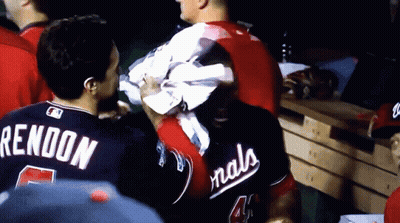 Man In Nationals Jersey Holding Towel Over Head GIF