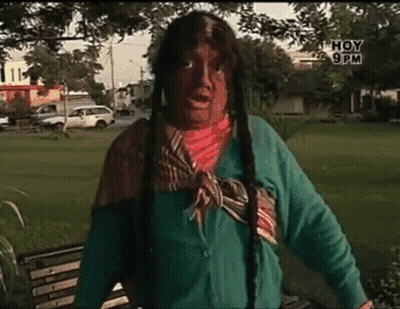 Man In Native American Costume Standing In Park With Hoy 9 PM GIF