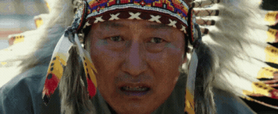 Man In Native American Headdress And Feathers GIF