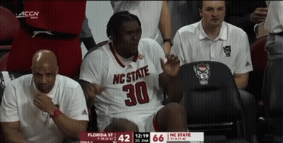 Man In NC State Jersey Sitting In Chair GIF