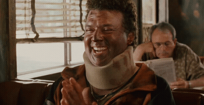 Man In Neck Brace Laughing And Clapping GIF