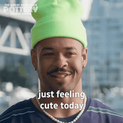 Man In Neon Green Beanie And Pearls Saying Just Feeling Cute Today GIF