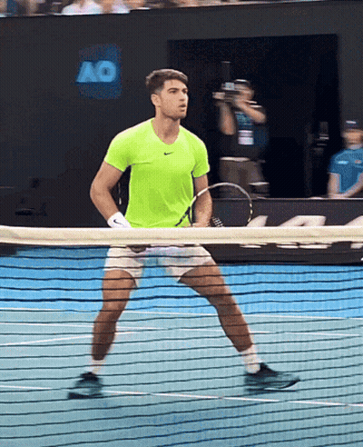 Man In Neon Green Shirt Holding Tennis Racquet GIF