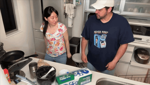 Man In Never Forget Shirt Next To Woman GIF