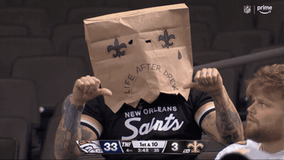 Man In New Orleans Saints Shirt With Paper Bag On Head GIF