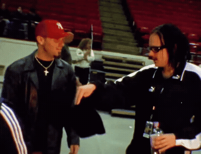 Man In New York Hat Talking To Another Man GIF