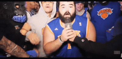 Man In New York Knicks Jersey Holding Microphone GIF