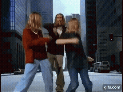 Man In New York Shirt Kissing Woman's Neck GIF