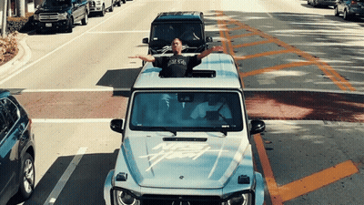 Man In New York T-Shirt Driving Mercedes GIF