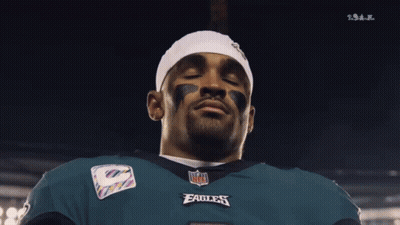 Man In NFL Eagles Jersey Looking Down Eyes Closed GIF