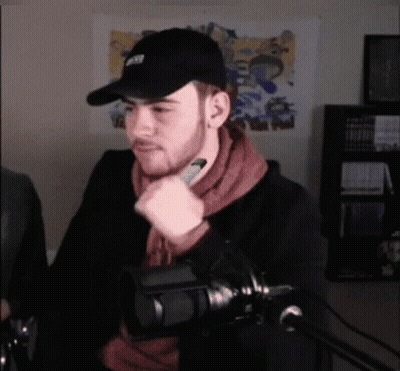 Man In NFL Hat At Microphone GIF