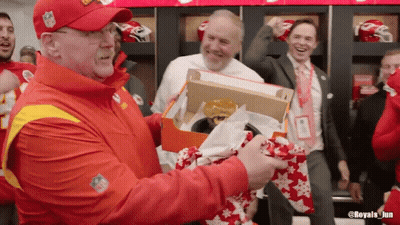 Man In NFL Hat Holding Box With Hamburger GIF