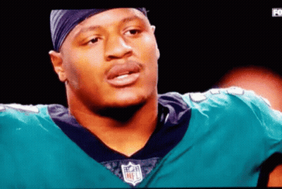Man In NFL Jersey On TV Screen GIF