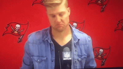 Man In NFL Shirt Standing At Red Wall GIF