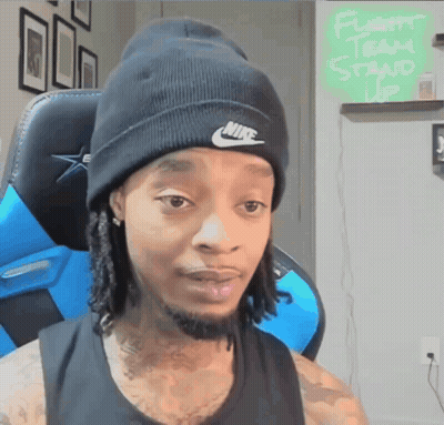 Man In Nike Beanie Sitting In Chair GIF