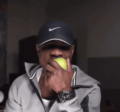 Man In Nike Hat Holding Tennis Ball GIF