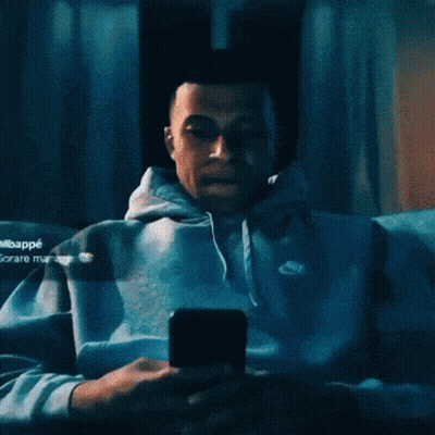 Man in Nike Hoodie Looking Up at Camera