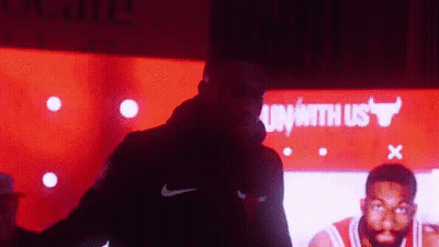 Man In Nike Jacket By Bulls Sign GIF