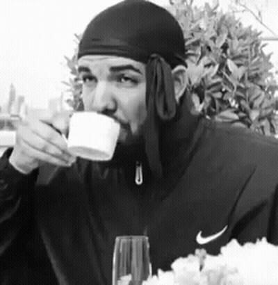 Man In Nike Jacket Drinking From Cup GIF