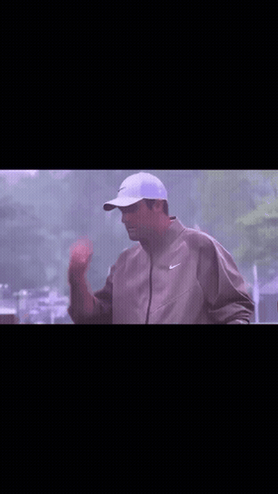 Man In Nike Jacket Holding Frisbee Over Head GIF