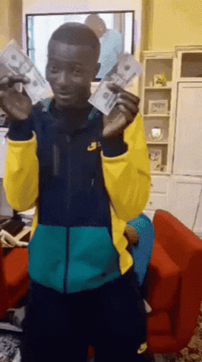 Man In Nike Jacket Holding Money GIF
