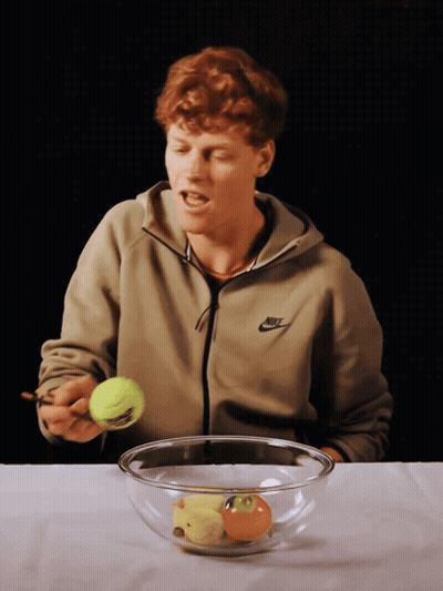 Man In Nike Jacket Holding Tennis Ball GIF