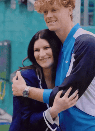 Man In Nike Jacket Hugging Woman In Blue Jacket GIF