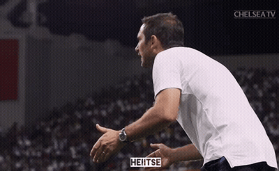 Man In Nike Jacket In Front Of Crowd GIF