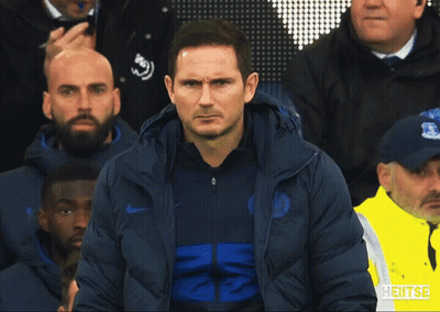 Man In Nike Jacket Stands In Front Of Crowd GIF