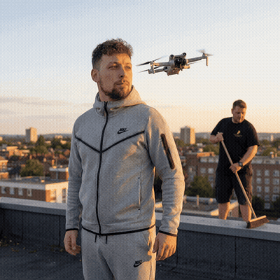 Man In Nike Jacket Watching Drone On Rooftop GIF