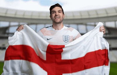 Man In Nike Shirt Holding Flag With Cross GIF