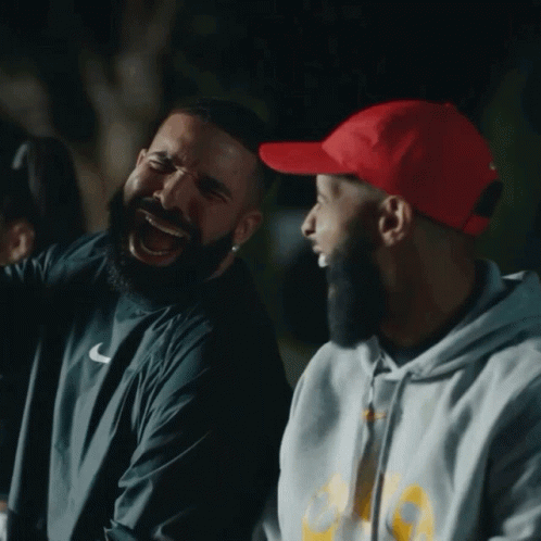 Man In Nike Shirt Laughing With Another Man GIF